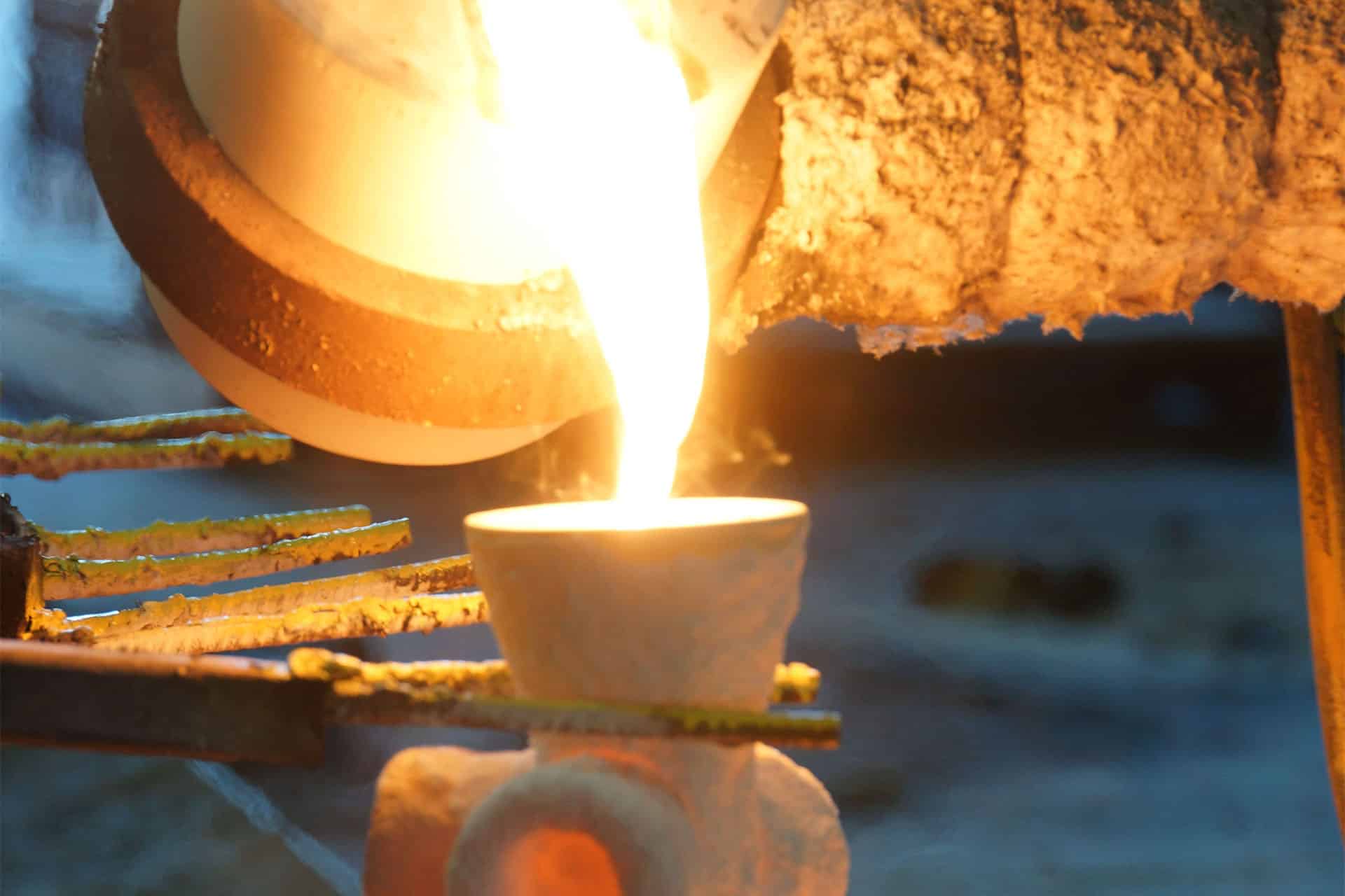 Metal pouring into a funnel