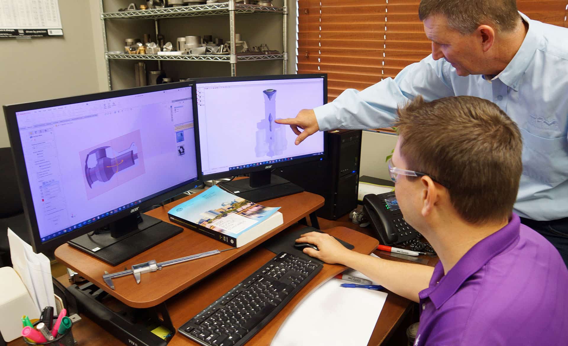 TPM employees working on a computer